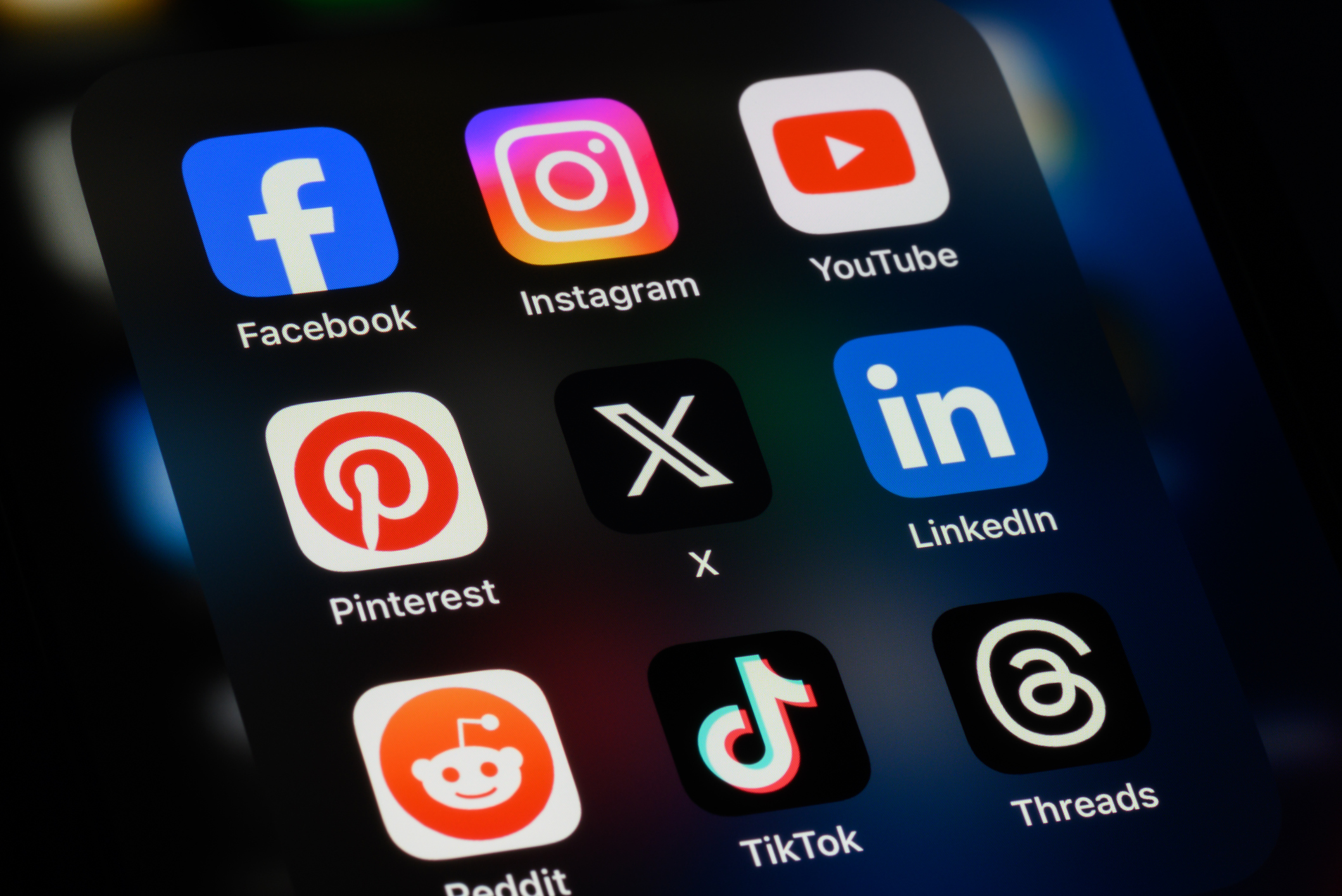 Toronto, Canada - September 24, 2023:  Popular social media apps on an Apple iPhone: Facebook, Instagram, YouTube, Pinterest, X (formerly Twitter), LinkedIn, Reddit, TikTok, and Threads.