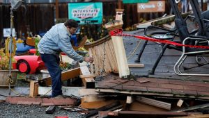 Homeowner Darren Gallagher inspects the collapsed second story porch of his house after a strong 6.4-magnitude earthquake struck off the coast of northern California, in Rio Dell, California, U.S. December 20, 2022.  REUTERS/Fred Greaves